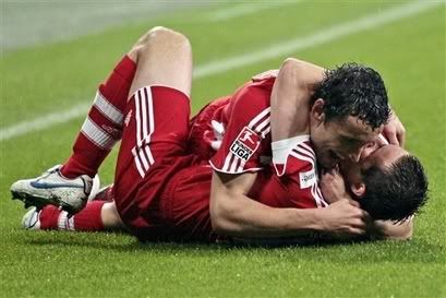 Mark van Bommel celebrates another of Miroslav Klose's goals